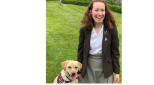 Katie trains a hearing dog for deaf people.